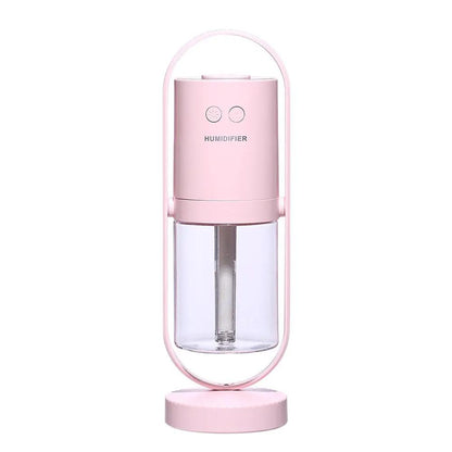 Pink USB ultrasonic mini air humidifier with projection night lights for home or office.