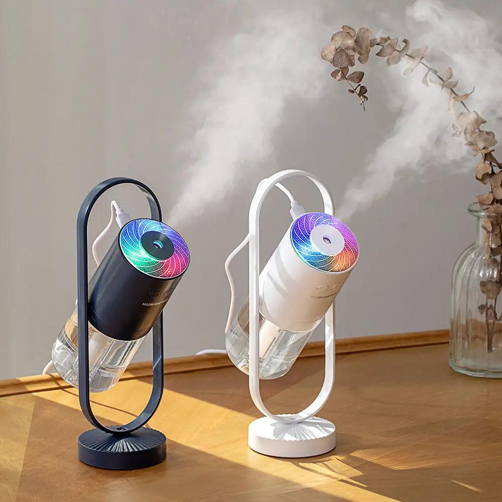 Two USB ultrasonic mini air humidifiers with projection night lights on oval stands, black and white models.