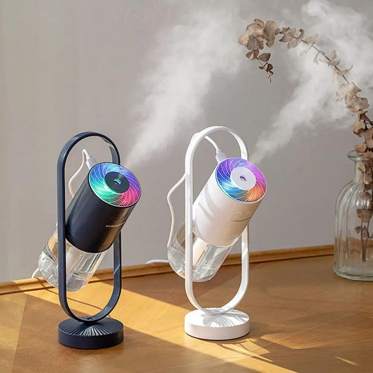 Two USB ultrasonic mini air humidifiers with projection night lights on oval stands, black and white models.