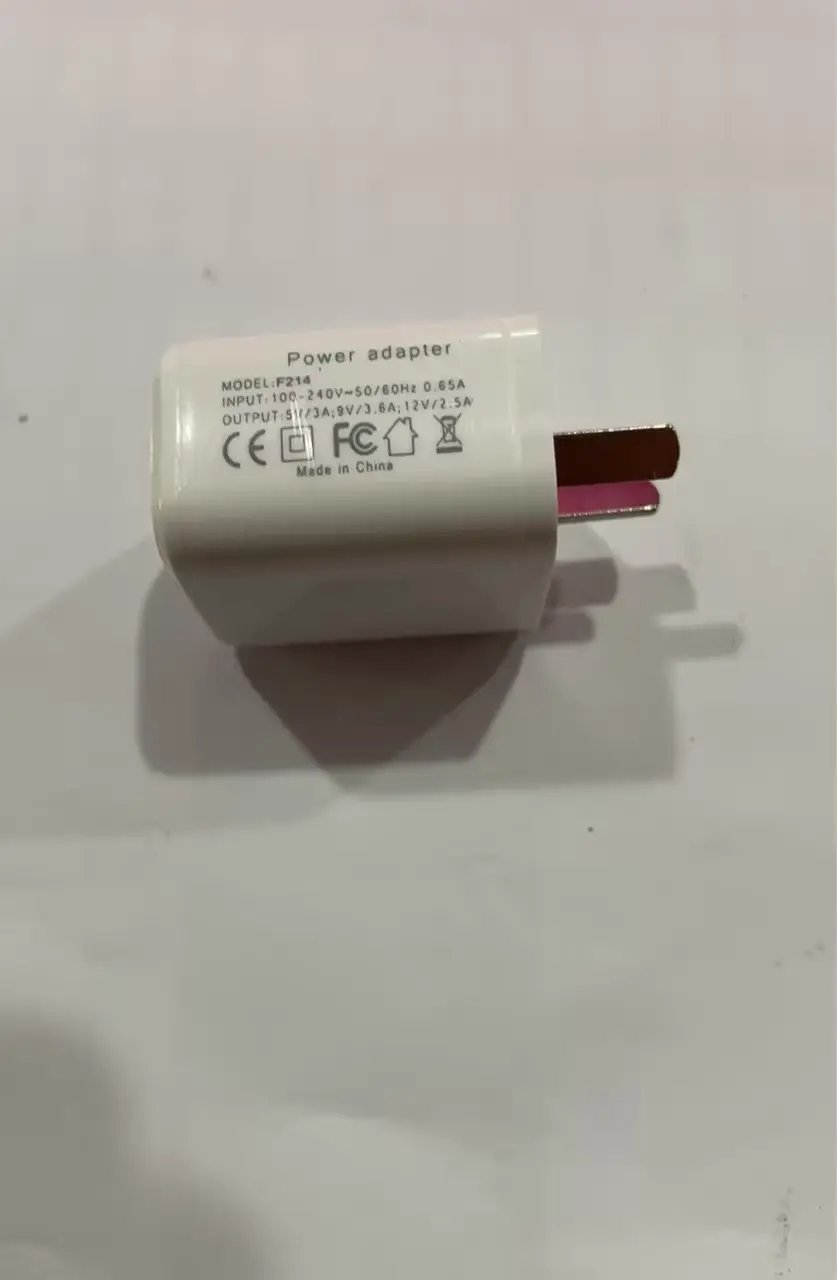 Two-prong power adapter labeled Power adapter, Made in China, used for G Shaped LED Lamp components.
