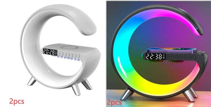 G-shaped LED lamp with Bluetooth speaker, wireless charger, and app control; white model and RGB-lit black variant.