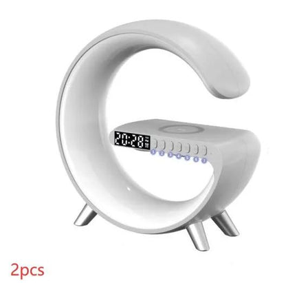G-shaped LED lamp with Bluetooth speaker, wireless charger, and app control; crescent lamp with a digital clock display.